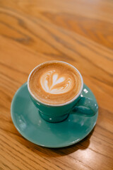 Latte art coffee in a blue mug