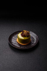 Pistachio cake or tart topped with green mousse with nuts and fruit filling. Pistachio pie