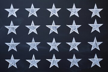 A grid of white stars drawn on a dark chalkboard surface
