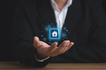 Smart home control concept. remote home control online home automation system. Businessman holding smart home technology on virtual screen.
