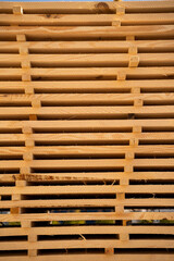 Stack of wooden planks arranged in piles for drying and construction, natural timber material used in carpentry and woodworking industry