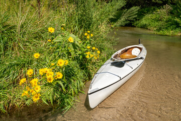 paddling in Nebraska Sandhills - expedition decked canoe in Long Pine Creek in late summer scenery