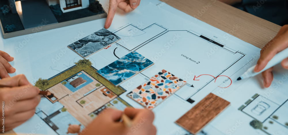 Poster a group of diverse individuals examines a detailed architectural floor plan, highlighting areas for 