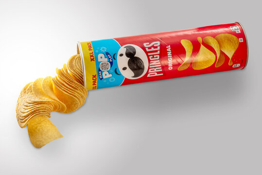 Italy - September 11, 2026: Pringles original potato chips in an XXL tube pack, it is a Kellogg Company brand.