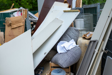 bulky waste reduction, large pile discarded furniture and wooden panels, renovation or decluttering process, used things on street, problem shredding garbage, diverted for recycling, pollution nature