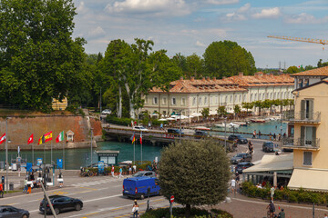 Peschiera del Garda, Italy - MAY, 30, 2024: Colorful cityscape with streets and buldings