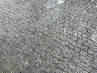 Abstract background. New cobblestone pavement closeup.