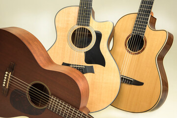 Trio of six and twelve string acoustic guitars