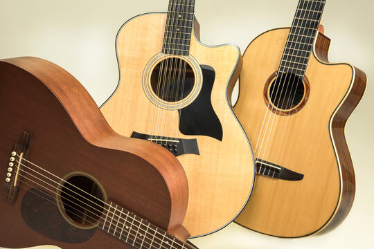 Trio of six and twelve string acoustic guitars