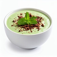 Creamy green dessert with chocolate shavings and mint garnish elegance on white background