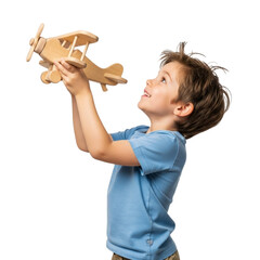 Boy playing with wooden airplane toy dreaming of flying and adventure childhood imagination and travel concept on transparent background