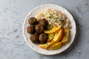 Meatballs and potatoes are delicious. Turkish name; kofte ve patates kizartmasi