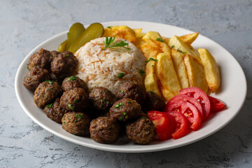 Meatballs and potatoes are delicious. Turkish name; kofte ve patates kizartmasi