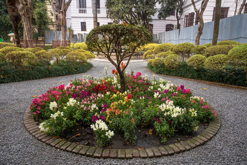 Tranquil view of the Garden of dreams in Kathmandu, Nepal. Beautiful landscaped garden with stone pathways, water fountains, blooming trees and elegant classical architecture offering a serene escape.