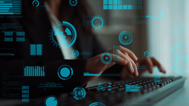 A focused woman types on a keyboard within a futuristic digital workspace, with vibrant data visualization elements overlaying her hands, symbolizing communication and technology. Xenic