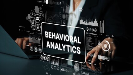 Business professional analyzing data with digital interface showcasing behavioral analytics insights and visual representations. Asymptotic smart data analytic.