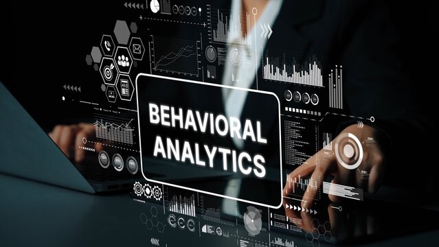 Business professional analyzing data with digital interface showcasing behavioral analytics insights and visual representations. Asymptotic smart data analytic.