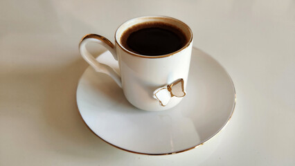 Turkish coffee served in a butterfly-patterned coffee cup