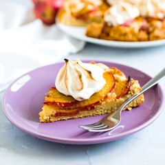 Peach and meringue tart slice on a purple plate