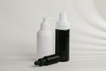 Cosmetic bottles dispensing products for body care and wellness