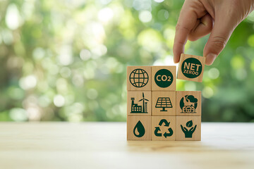 Hand placing block with esg symbol on stack representing sustainable business and environmental responsibility