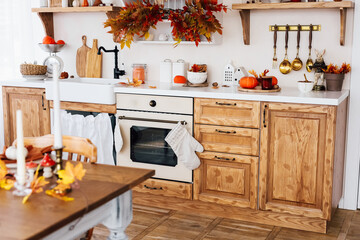 Rustic kitchen decor with autumn elements and cozy atmosphere in well organized space