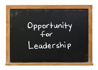 Obraz premium Opportunity for leadership written in white chalk on a black chalkboard in a wooden frame