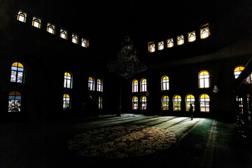 a mosque with light coming through its windows