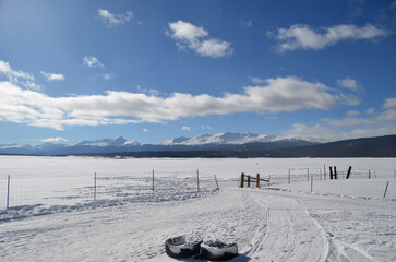Snow Capped Peaks with a Snow Covered Field