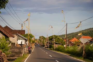 The road decorated for the holiday in the village. Bamboo decorations along the road.