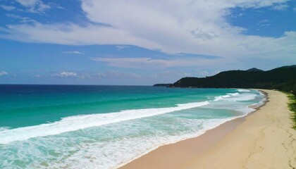 Obraz premium Pristine beach meets turquoise sea under a vibrant sky