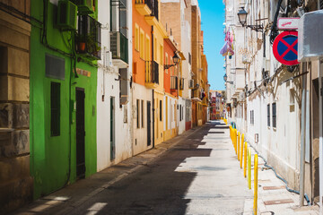 Naklejka premium Historic buildings on a typical street in the old part of the coastal Denia town. Location place province of Alicante, Costa Blanca, Valencian Community, Spain, Europe.