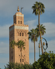 View of The Ancient tower of Koutoubia Mosque from The Koutoubia Gardens, Marrakesh, Morocco.