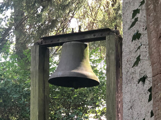 Obraz premium Bell in the garden of the retreat house in 54655 St. Thomas, Germany on August 31, 2022