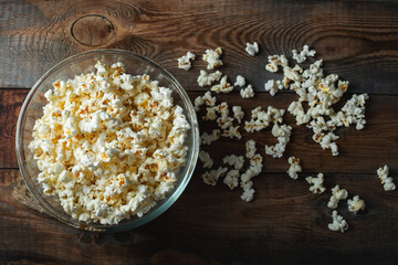 Pop corn on wood color background.Food and snack concepts ideas.Minimal style top view mockup
