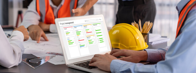 Project planning software for brisk business project management on the computer screen showing...
