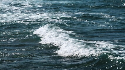 Deep Blue Ocean Waves Crashing With White Foam