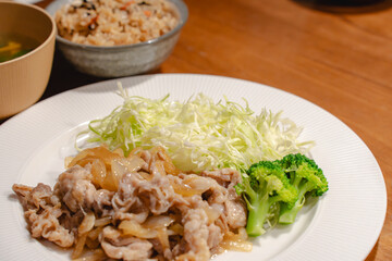 Japanese dinner with pork ginger stir fry and shredded cabbage
