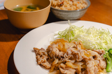 Japanese dinner with pork ginger stir fry and shredded cabbage
