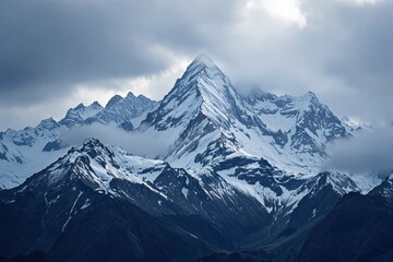 Towering snowy mountain range with sharp peaks and misty clouds, photorealistic style, under a moody cloudy sky background, concept of wilderness. Ai generative
