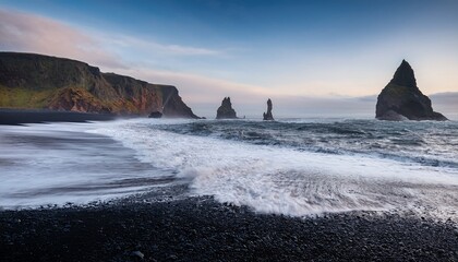 waves on black icelandic beach in the evening with rocks and cliffs in the backround