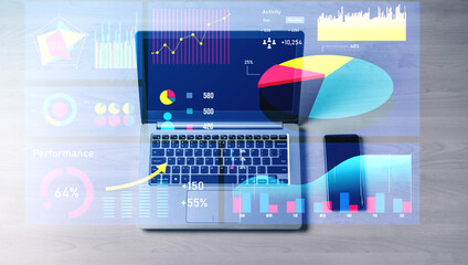 Modern laptop displays vibrant data visualization graphics, representing performance analytics and insights in a contemporary workspace environment. Impute