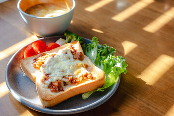Breakfast with cheese toast and vegetables

