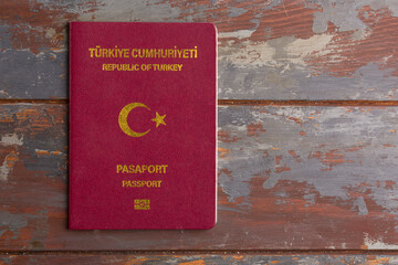 Turkish passport on light wooden background