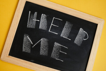 chalk writing on black board help me mental health concept