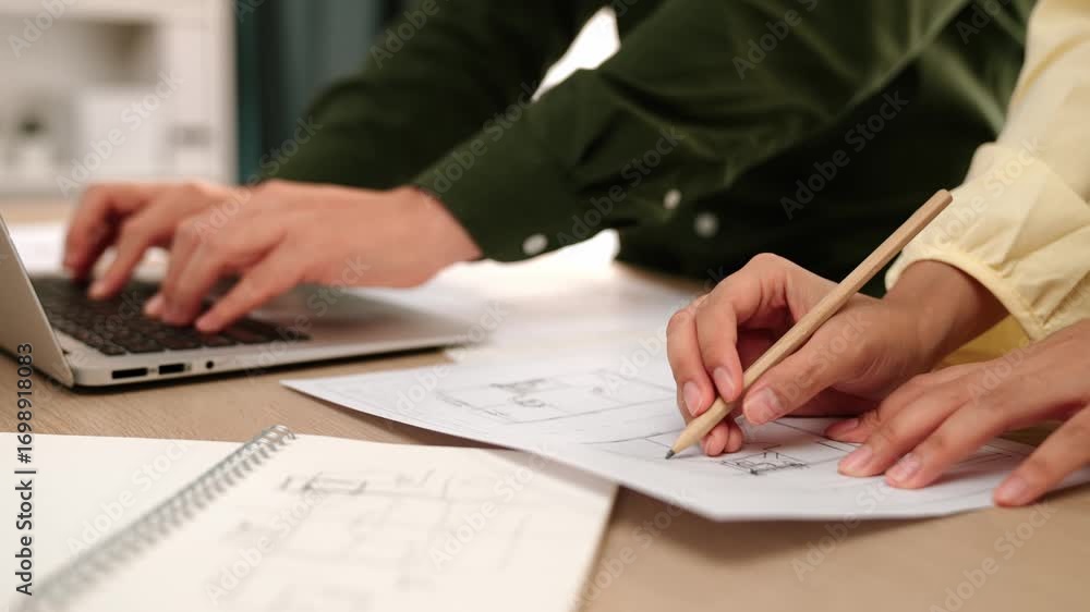 Poster architect and safety engineer write about construction detail blueprint display in laptop on table u