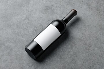 Fototapeta premium Dark bottle of wine, blank label, on gray surface