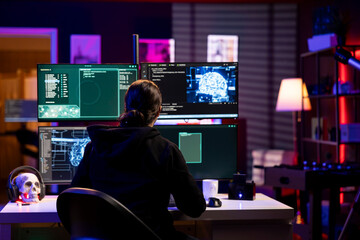 Hacker doing ransomware attacks using artificial intelligence to hold company systems hostage and...