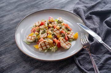 Salad with mozzarella cheese and oranges. 