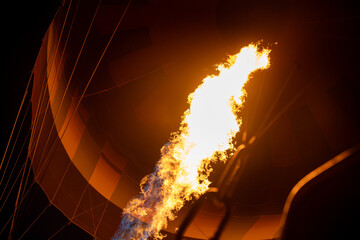 Hot air balloon flame ignition at night in Cappadocia, Turkey - spectacular fire display